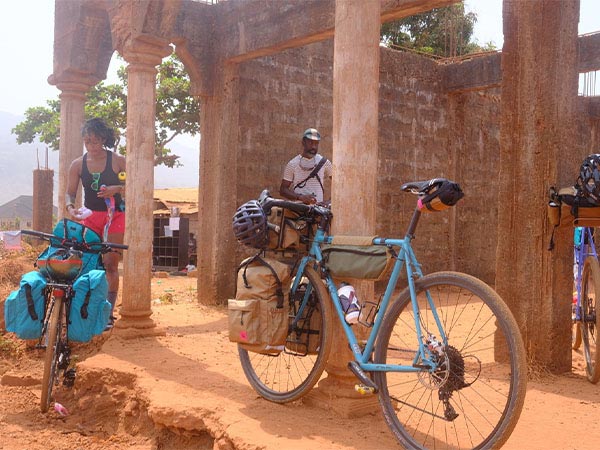 Loaded bikes parked next to building taking a break