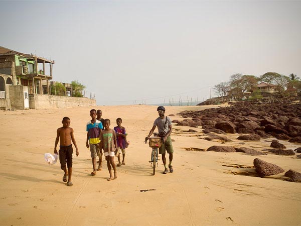 Slim Wonder walking bike on sandy beach with children