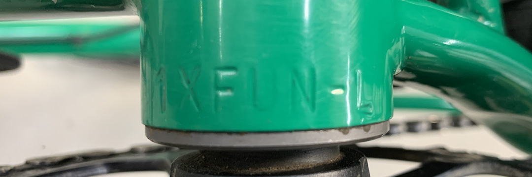 Close up view of the serial number on the bottom bracket a green Surly bike frame