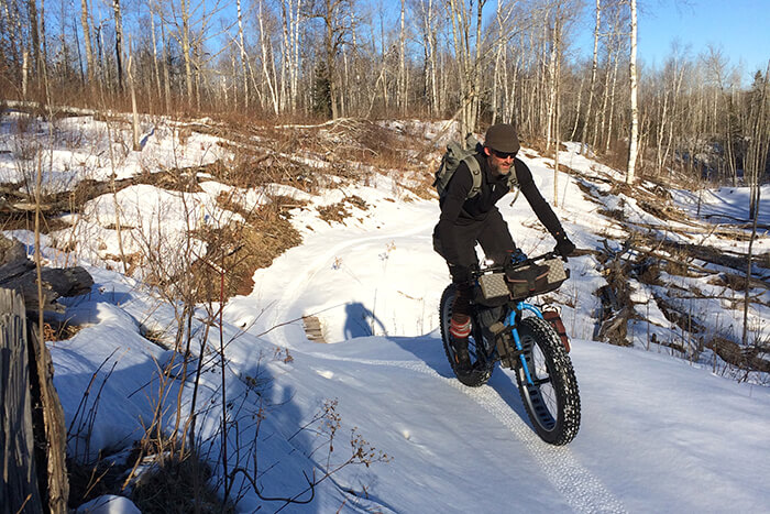 Rider Navigating a winter bike trail in snow