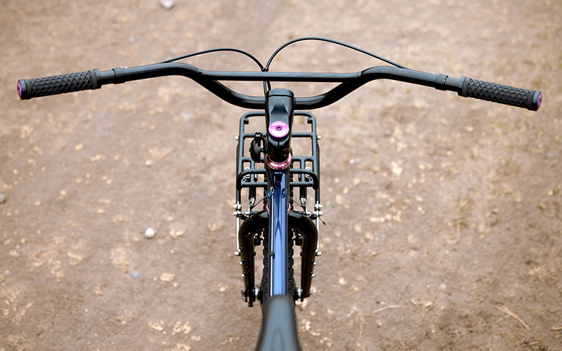 Top down view of front end of bike; handlebars, grips, stem, headset, front rack