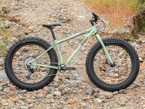 Surly Ice Cream Truck complete bike, side view, propped up on washed out gravel road